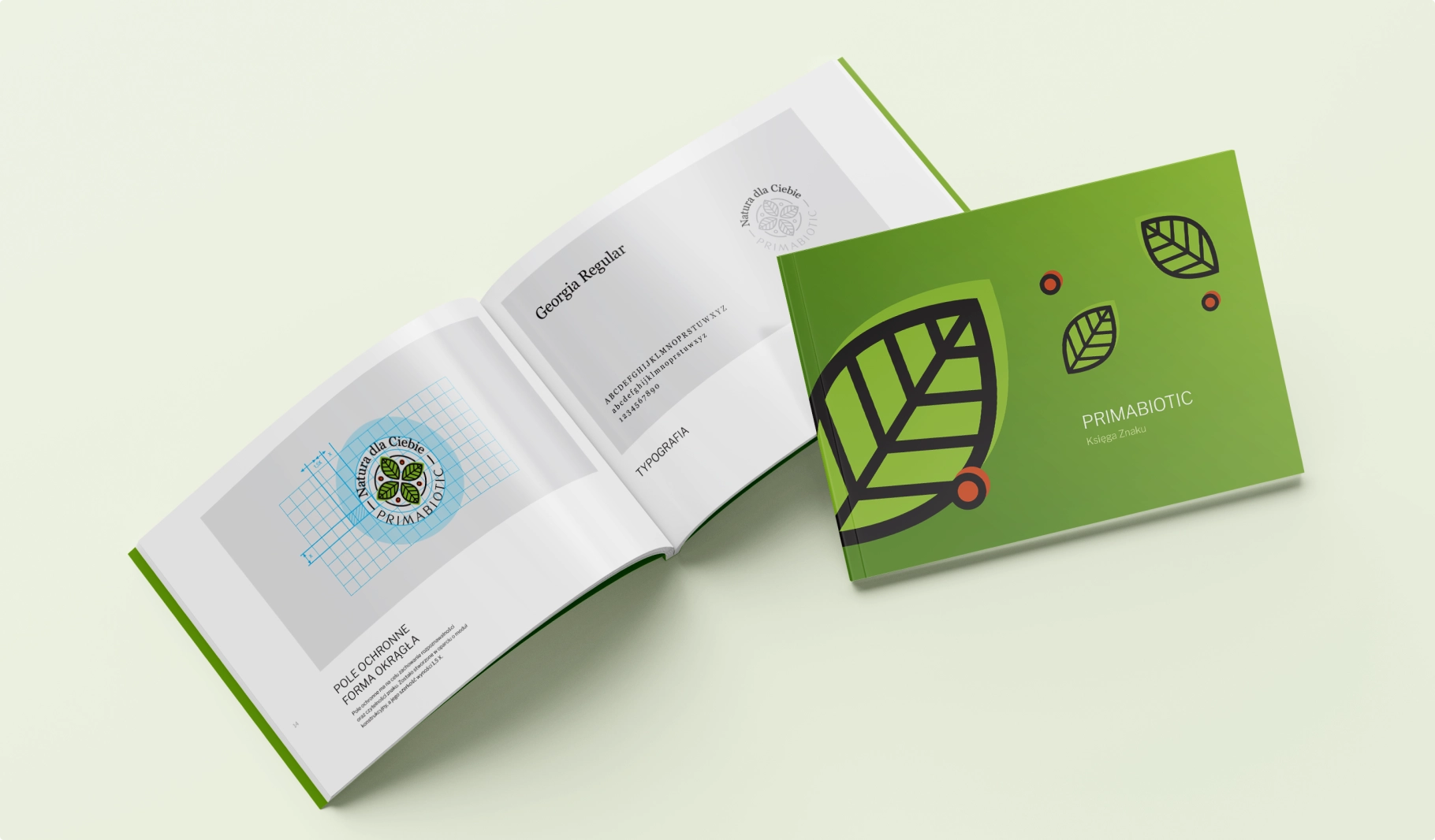 Księga znaku PRIMABIOTIC – prezentacja logo, typografii i zasad identyfikacji wizualnej. Motywy ekologiczne podkreślają naturalny charakter marki.